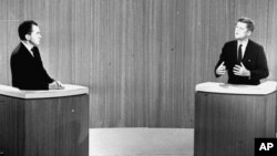 FILE - Democratic Sen. John F. Kennedy, right, speaks and Republican Vice President Richard Nixon listens during the fourth presidential debate from a New York studio. The fall debates are always a big part of any presidential campaign, Oct. 21, 1960.