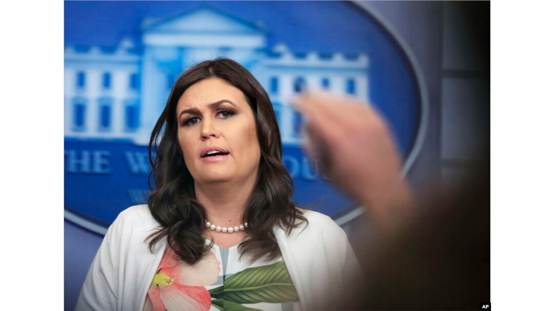 FILE - White House Press Secretary Sarah Huckabee Sanders talks to reporters during a press briefing in the Brady Press Briefing Room at the White House, in Washington, Nov. 27, 2017. Huckabee Sanders said the intent of the videos was to raise awarenes about national security threats.