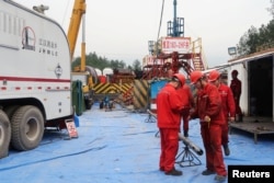 Employees work at a shale gas fracking site of Sinopec in Nanchuan, Chongqing, China March 18, 2018.