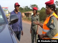 Cameroon gendarmes in Bertoua, east Cameroon, control vehicles on the way to the Central African Republic, Jan. 5, 2019.