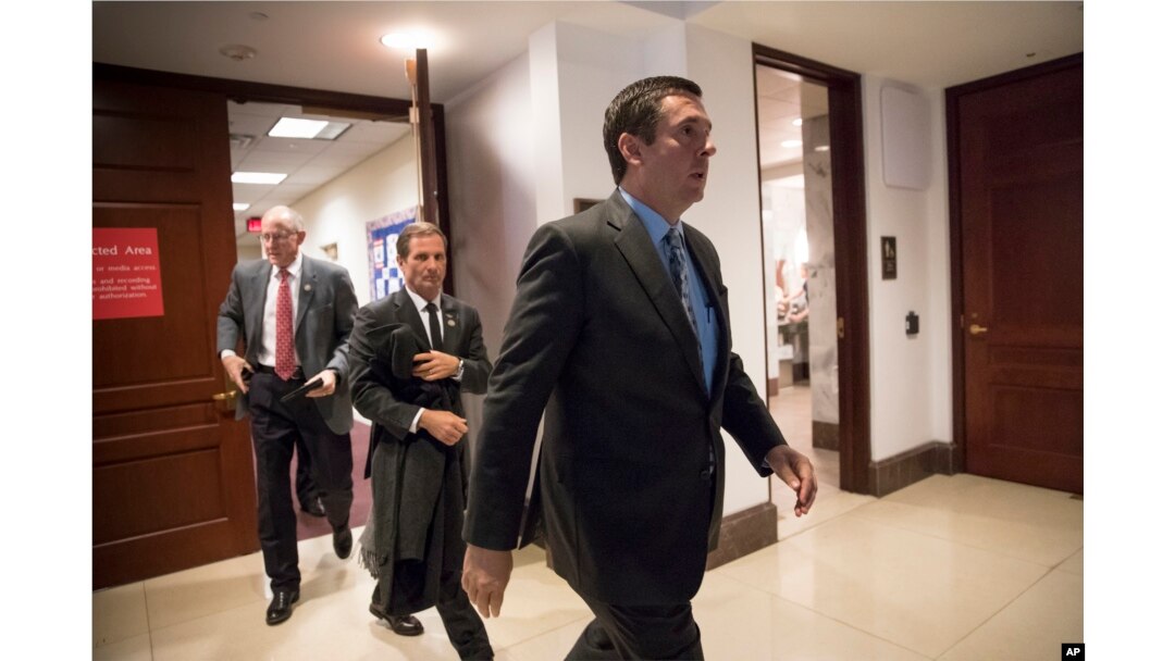 FILE - House Intelligence Committee Chairman Devin Nunes, R-Calif., followed by Rep. Chris Stewart, R-Utah, and Rep. Mike Conaway, R-Texas, far left, leave the secure area where the panel was wrapping up its inquiry into Russian meddling in the 2016 election, on Capitol Hill in Washington, Thursday, March 22, 2018.