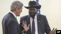 S. Sudan's President Salva Kiir chats with U.S. Secretary of State John Kerry as he greets Kerry at the President's Office in Juba, South Sudan, May 2, 2014.