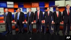 FILE - Republican presidential candidates take the stage before the Republican presidential debate at the North Charleston Coliseum, Jan. 14, 2016, in North Charleston, S.C.