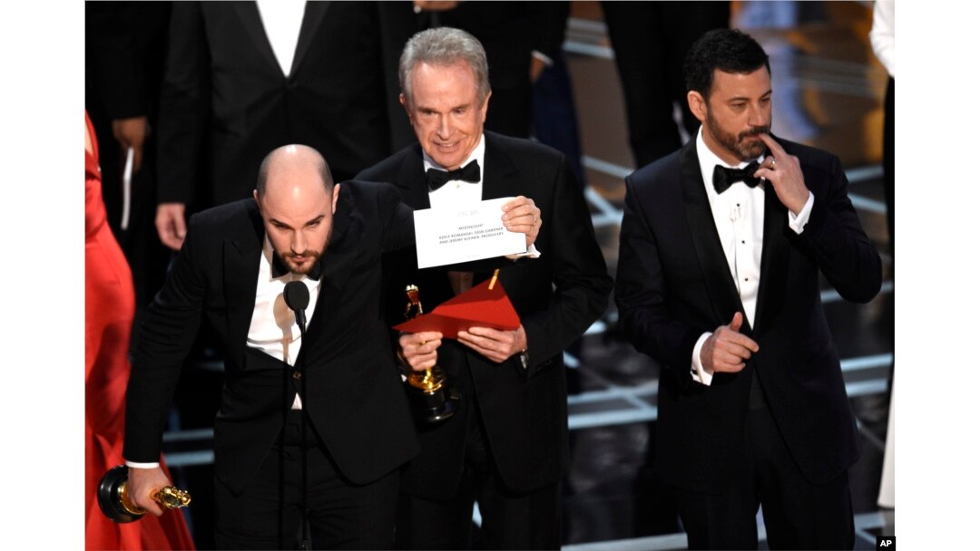Jordan Horowitz shows the envelope revealing "Moonlight" as the true winner of best picture at the Oscars, Feb. 26, 2017, at the Dolby Theatre in Los Angeles.