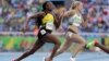 Jamaica's Elaine Thompson, left, and Germany's Gina Luckenkemper compete in a women's 200-meter heat during the athletics competitions of the 2016 Summer Olympics at the Olympic stadium in Rio de Janeiro, Brazil, Aug. 15, 2016. 
