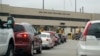 FILE - In this July 20, 2018 photo, traffic backs up at the border station as motorists leave Manitoba, Canada, for the United States at Pembina, N.D. 