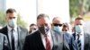 U.S. Secretary of State Mike Pompeo, center, wearing a mask, is seen during a walking tour of Dubrovnik's Old Town, Croatia, Oct. 2, 2020. Pompeo visited Croatia as part of his six-day trip to Southern Europe. 