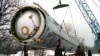 FILE - Soldiers prepare to destroy a ballistic SS-19 missile in the yard of the largest former Soviet military rocket base in Vakulenchuk, Ukraine, Dec. 24, 1997. 