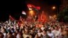 Supporters of the ruling conservative VMRO-DPMNE party rally in front of the Parliament building in Skopje, Macedonia, May 18, 2015. 