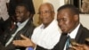 FILE - Uganda opposition leaders, from left to right: Forum for Democratic Change, Dr. Kizza Besigye, former Prime Minister Amama Mbabazi and Democratic Party President Norber Mao meet at the Democratic Alliance office in Kampala, Sept. 18, 2015.
