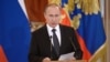 Russian President Vladimir Putin addresses members if the military in Moscow's Kremlin, March 17, 2016. 