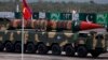 FILE - A Pakistani-made Shaheen-III missile, capable of carrying nuclear warheads, loaded on a trailer rolls down during a military parade to mark Pakistan's Republic Day in Islamabad, Pakistan, March 23, 2016. 