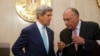 U.S. Secretary of State John Kerry and Egypt's Foreign Minister Sameh Shukri talk at the presidential palace in Cairo July 22, 2014.