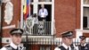 WikiLeaks founder Julian Assange steps onto the balcony before speaking to the media outside the Ecuador embassy in west London, August 19, 2012.