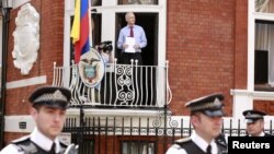 WikiLeaks founder Julian Assange steps onto the balcony before speaking to the media outside the Ecuador embassy in west London, August 19, 2012.