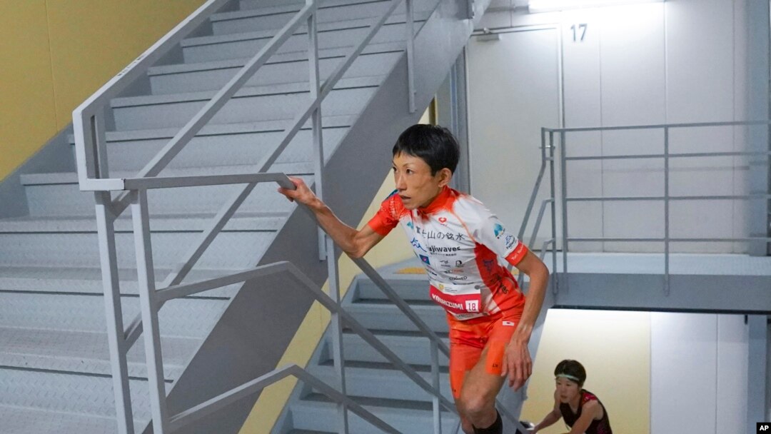 FILE - In this photo provided by ISF/Meeting, runner Yuri Yoshizumi competes during a race of Stairclimbing World Championships in Osaka, western Japan, on Nov. 19, 2023. (ISF/MEETING via AP)