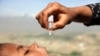 An Afghan health worker vaccinates a child as part of a campaign to eliminate polio, on the outskirts of Kabul, Afghanistan, April 18, 2017.