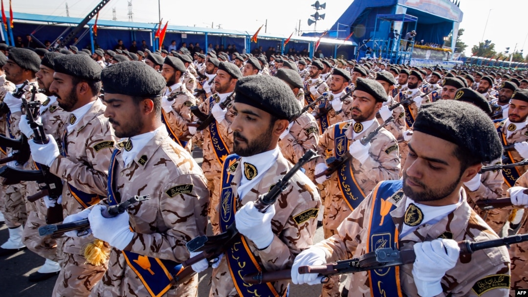 FILE - Members of Iran's Revolutionary Guards Corps (IRGC) march during the annual military parade marking the anniversary of the outbreak of the devastating 1980-1988 war with Saddam Hussein's Iraq, in the capital Tehran, Sept. 22, 2018. 