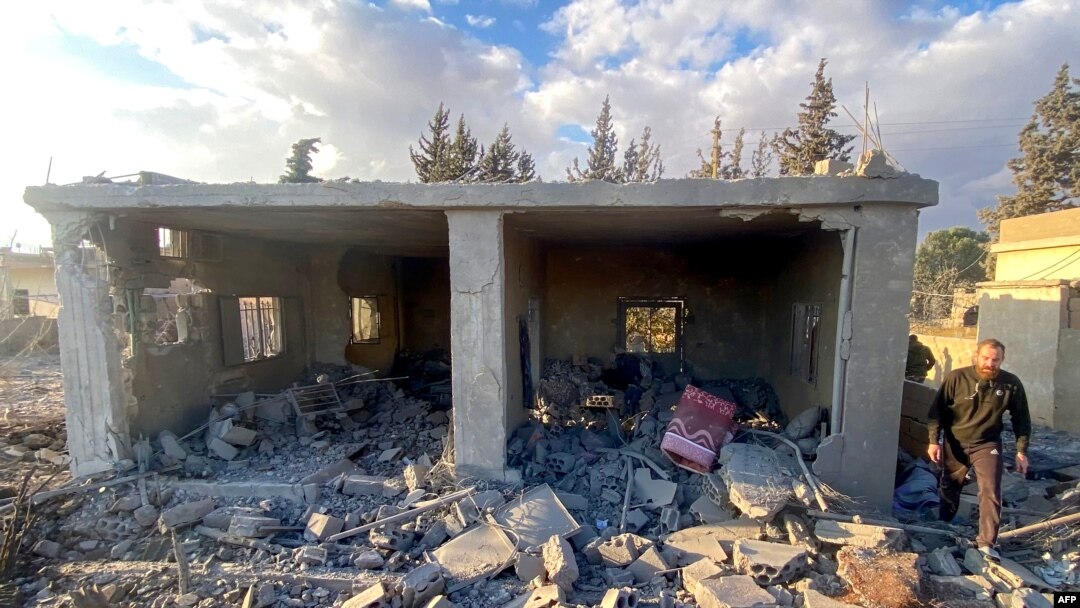 A man inspects the damage at the site of an Israeli airstrike that targeted the village of Makneh in eastern Lebanon, Nov. 21, 2024, amid the war between Israel and Hezbollah.