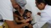 A boy cries as he receives a vaccine against yellow fever at a public health center in Sao Paulo, Brazil, Jan. 16, 2018.