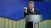 Ukrainian President Petro Poroshenko gestures while speaking during a news conference in Kyiv, Ukraine, Jan. 14, 2016.