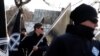 FILE - Members of Neo-Nazi groups are seen at a rally in Budapest, Hungary, Feb. 8, 2020.