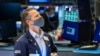Trader Robert Charmak works on the floor on Jan. 24, 2022, in this photo provided by the New York Stock Exchange,
