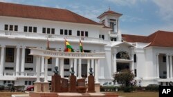 FILE - The Ghana national flag (C) flies in front of the Supreme Court building in the city of Accra, Ghana.