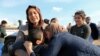 FILE - Relatives hug a Yazidi survivor following the boy's release from Islamic State militants in Syria, in Duhok, Iraq, March 2, 2019.