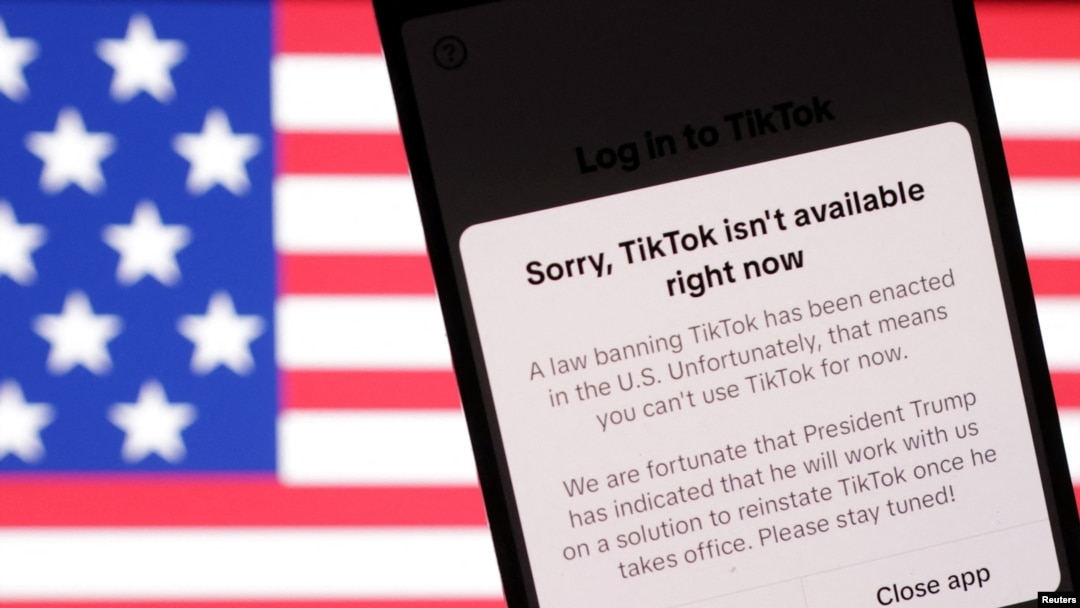 U.S. flag and TikTok app with the message "Sorry, TikTok isn't available right now" are seen in this illustration taken, Jan. 19, 2025. 