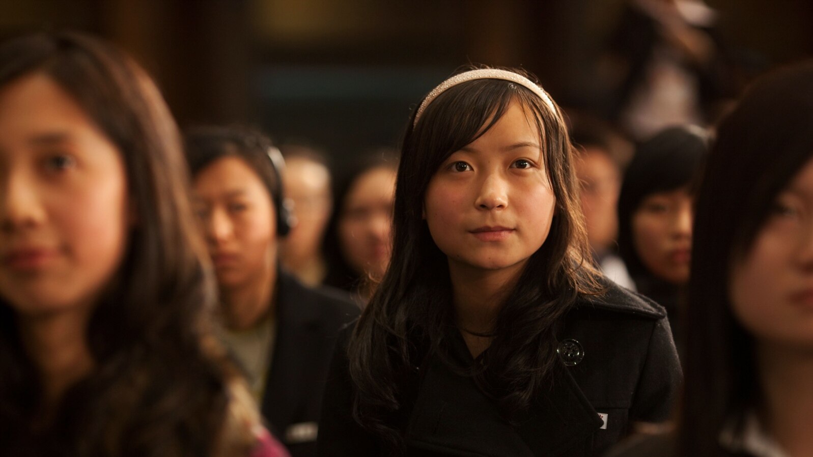 Chinese students listen to President Obama speak during a town hall in China.