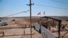 Iraqi and Syrian border guards prepare to open the crossing between the Iraqi town of Al Qaim and Syria's Albukamel in Qaim, Sept. 30, 2019.