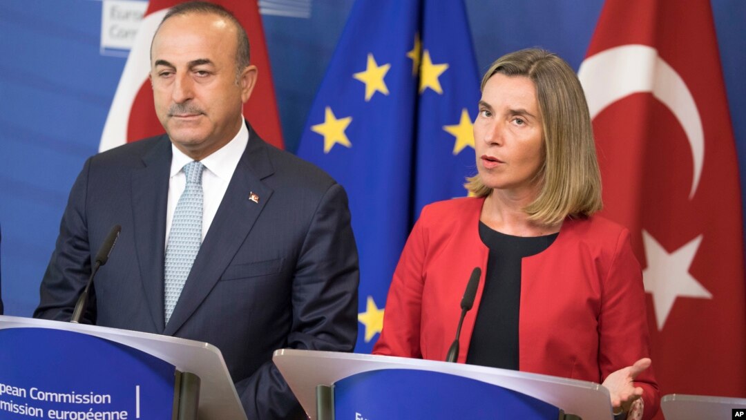 Turkey's Foreign Minister Mevlut Cavusoglu, left, and High Representative of the European Union for Foreign Affairs and Security Policy Federica Mogherini, speak at a press conference in Brussels, July 25, 2017.