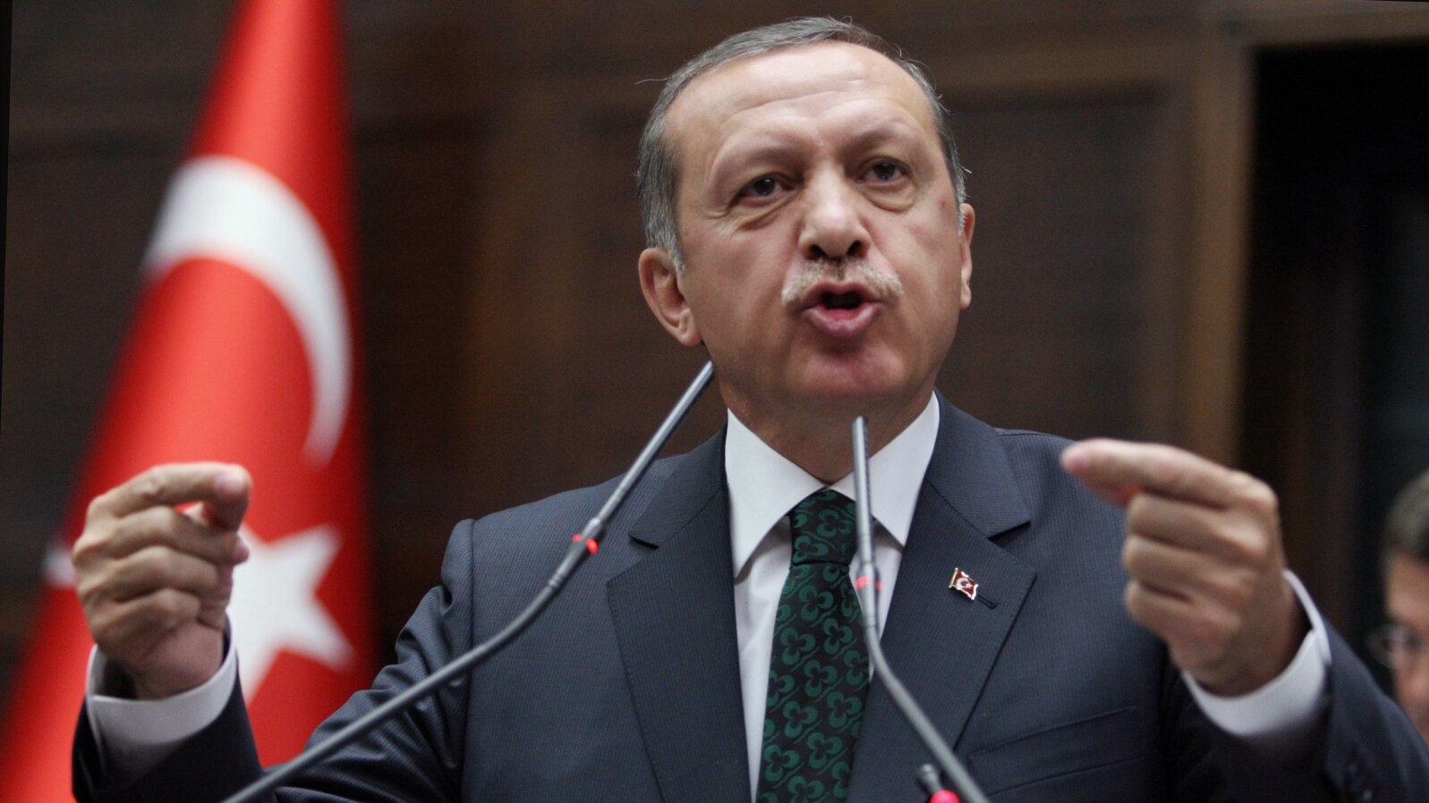 Turkish Prime Minister Recep Tayyip Erdogan addresses his supporters and lawmakers at the parliament in Ankara, Turkey, Tuesday, June 25, 2013.