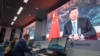 屏幕上显示中国国家主席习近平通过视频在2020年11月4日在上海的媒体中心发表讲话。