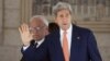 U.S. Secretary of State John Kerry, right, and chief Palestinian negotiator Saeb Erekat arrive at a meeting with Palestinian President Mahmoud Abbas in the West Bank city of Ramallah, July 23, 2014.