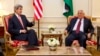 US Secretary of State John Kerry (l) meets with Palestinian President Mahmoud Abbas in Paris, Feb. 19, 2014.