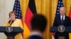 President Joe Biden and German Chancellor Angela Merkel listen to a question during a news conference in the East Room of the White House in Washington, July 15, 2021.