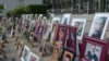 Portraits of Syrian detainees are seen at Koblenz court in Germany where trials started last June of two people alleged to be former Syrian intelligence officials involved in crimes against humanity inside Syrian prisons. (Courtesy: Maimouna al-Ammar)