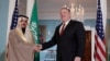 Secretary of State Mike Pompeo, right, shakes hands with Saudi Foreign Minister Faisal bin Farhan Al Saud, Feb. 12, 2020, at the State Department in Washington. 