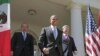 U.S. President Barack Obama, (C), Canada's Prime Minister Stephen Harper (R), and Mexico's President Felipe Calderon (L) walk out of the Oval Office before a joint press conference in the Rose Garden of the White House in Washington, April 2, 2012.