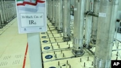 FILE - This photo released on Nov. 5, 2019, by the Atomic Energy Organization of Iran shows centrifuge machines in the Natanz uranium enrichment facility in central Iran. (Atomic Energy Organization of Iran via AP)