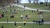 FILE-People visit the Raslambshovsparken Park in Stockholm, Sweden, Saturday April 18, 2020.