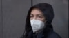 Radio Free Europe-Radio Liberty editor Alsu Kurmasheva stands in a glass cage in a courtroom in Kazan, Russia, Monday, Oct. 23, 2023.