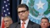 Gov. Rick Perry listens to a reporter's question during a news conference in the governor's press room in Austin, Texas, July 21, 2014.