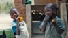 FILE - Children are seen enjoying orange sweet potatoes. (Courtesy - HarvestPlus)