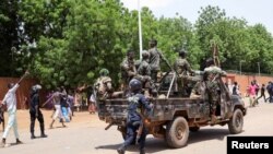 Pro-junta protesters gather outside the French Embassy in Niamey