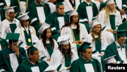 FILE- Reynolds High School students at their graduation ceremony. The Civil Rights Project at UCLA says persistent segregation is worst in northern and western states.