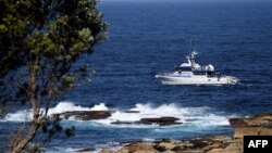 A fisheries boat patrols the site of a fatal shark attack off Little Bay Beach in Sydney on Feb. 17, 2022, as authorities try to catch a great white shark that killed a swimmer, the city's first such attack in decades. 