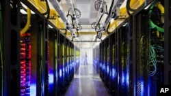 An undated file photo made available by Google shows the campus-network room at a data center in Council Bluffs, Iowa. 
